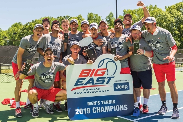 Celebratory shot of 2019 Mens Tennis team holding BIG EAST banner