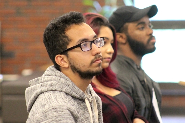 Students sitting in audience of forum discussion