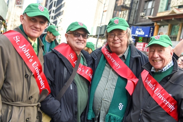 John Clarke at the St. Patricks Day Parade posing with 3 other men