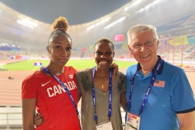 Maya Stephens posing with two other people infront a frack