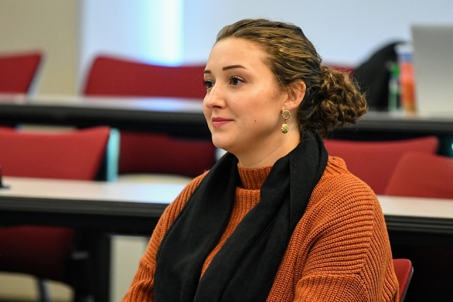Woman listening to SJU Annual Catholic Lecture 