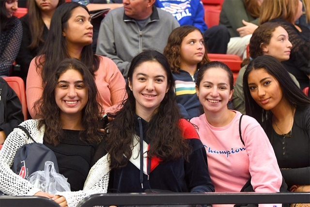 Girls in the front row smile for camera