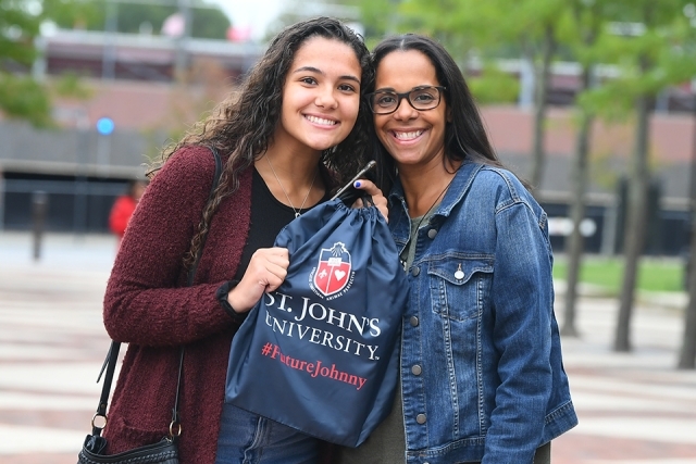 Guests showing off gift bag
