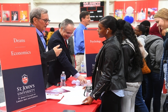 Guests speak to members of Economics department