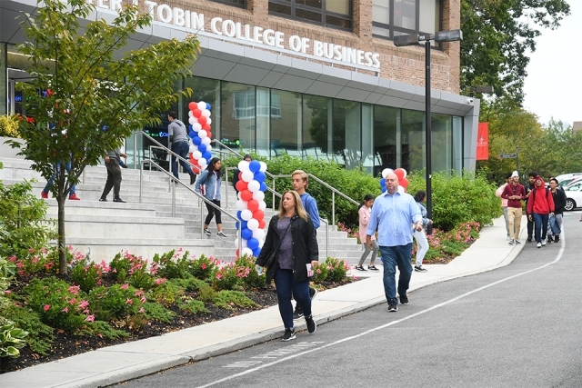 Guests walking past Tobin College entrance