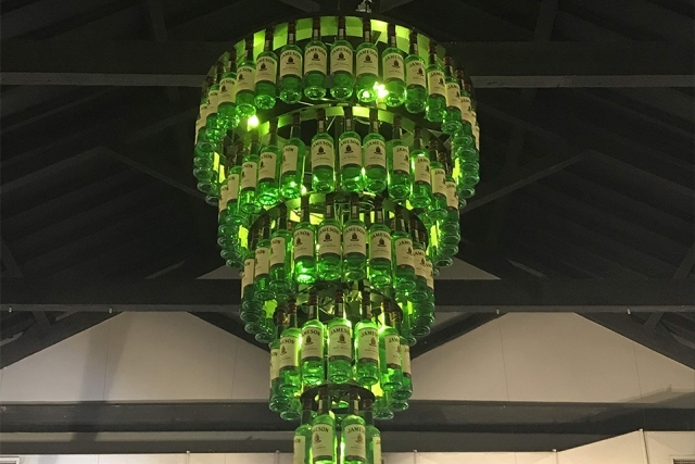 Chandelier of green glass bottles