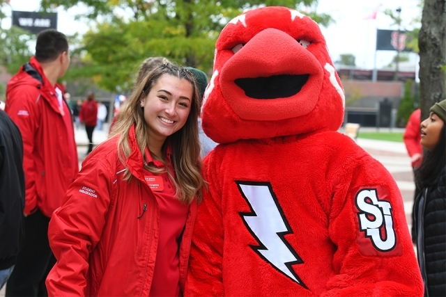 Johnny mascot and ambassador smiling