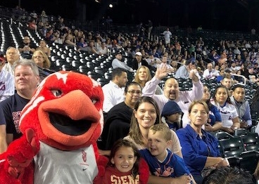 Johnny Thunderbird sitting in the stand at Citi Field