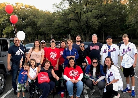 Group shot of employees who attended baseball field
