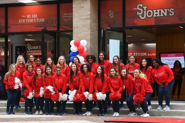 SJU cheer squad posing for photo