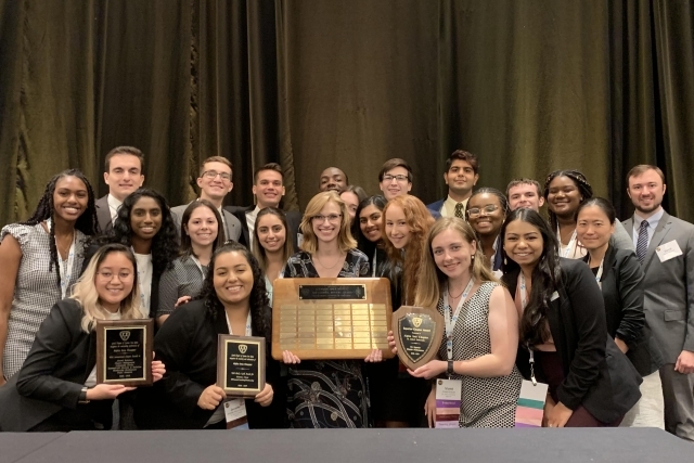 SRM Gamma Students holding award
