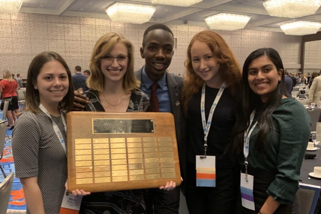 SRM Gamma Students holding award 