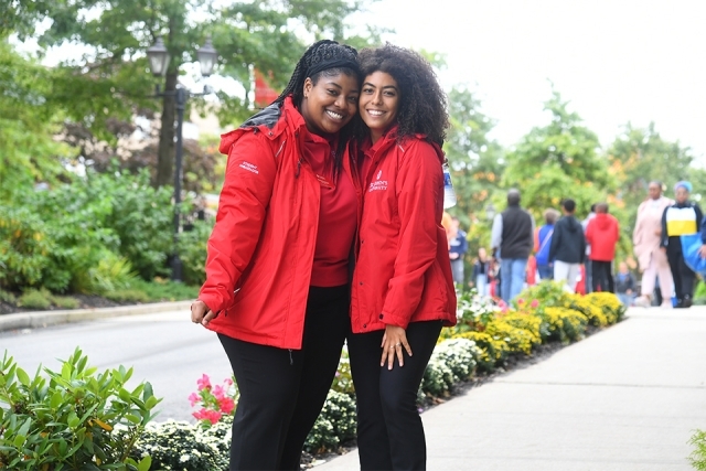 Student Ambassadors smiling in red jackets