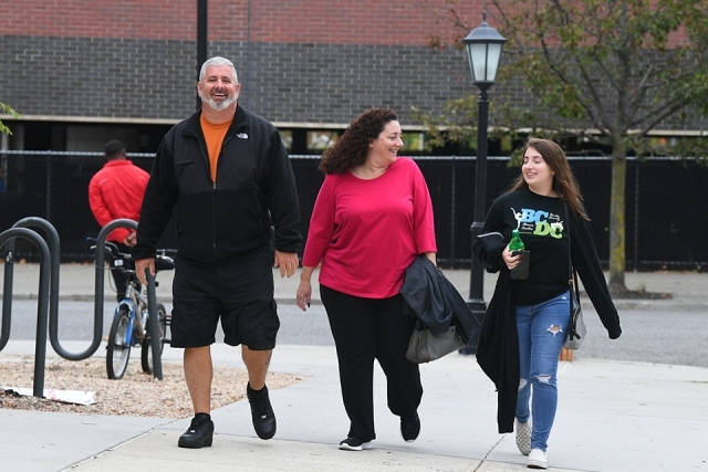 Three guests arriving to campus
