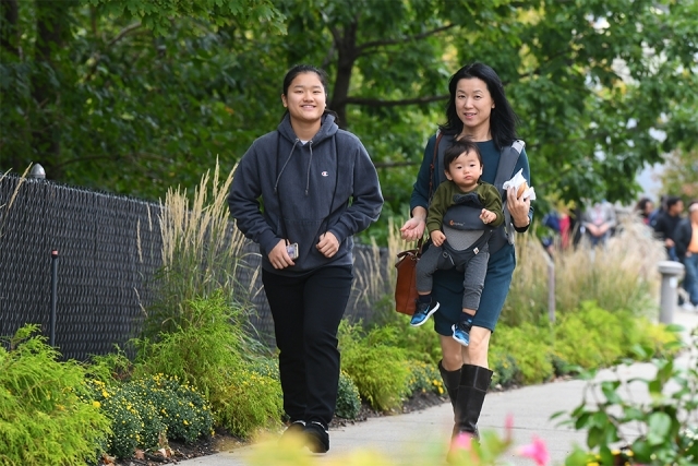 Two adult guests and baby guest arriving