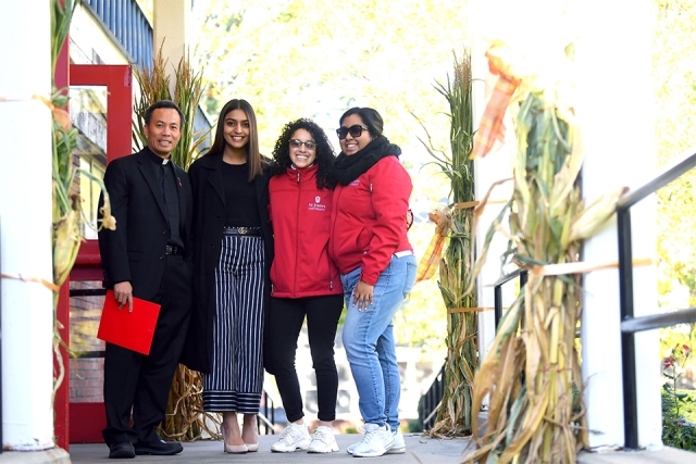 Welcoming families at SI Open House