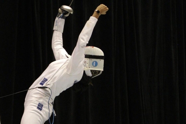 Iris Washington throwing her hands up celebrating