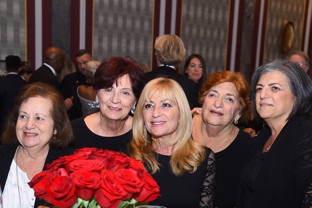 Red roses and guests at the 2019 President’s Dinner