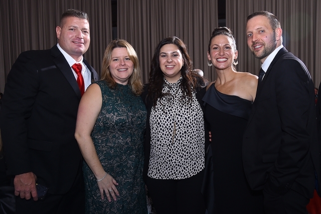 Five guests pose for a photo at the St. John’s University 2019 President’s Dinner
