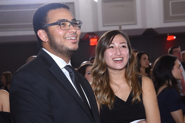 Two guests smiling and looking up at the St. John’s University 2019 President’s Dinner