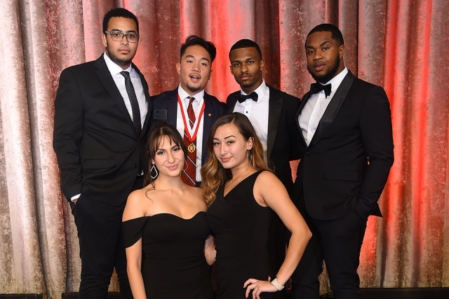 Six guests pose for a photo at the St. John’s University 2019 President’s Dinner