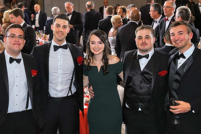 Five guests pose for a picture at the St. John’s University 2019 President’s Dinner