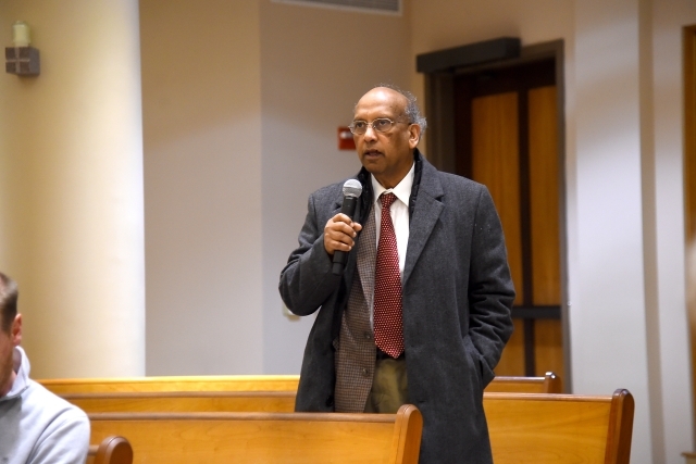Lecture attendee holding the microphone