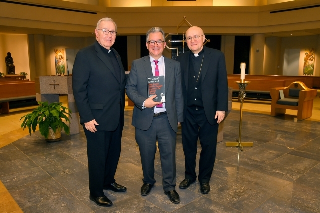 Austen Ivereigh with two members of St. John's community