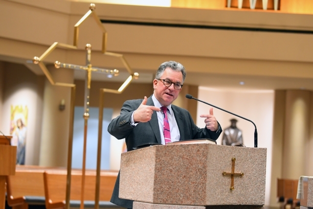 Austen Ivereigh speaking at the podium
