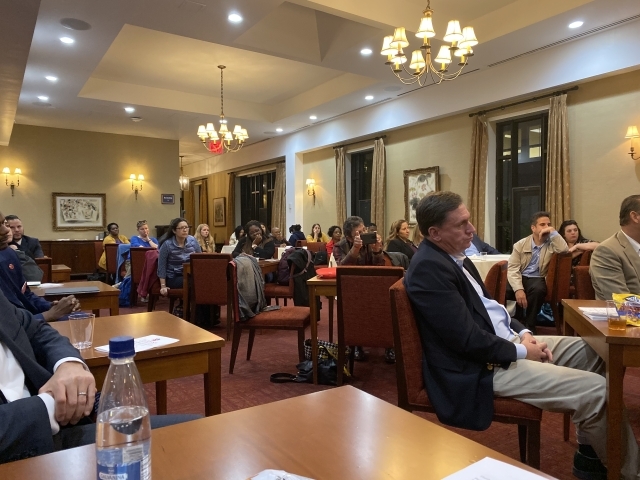 Participants listen attentively to dialogue with Dr. Montalbano.