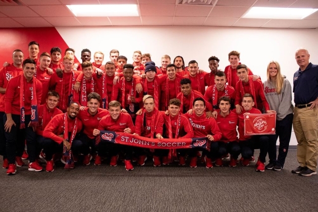 2019 Men's Soccer Team holding a St. John's Soccer Banner