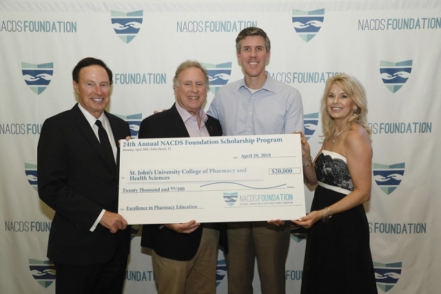 People holding a check for NACDS Foundation Scholarship Program