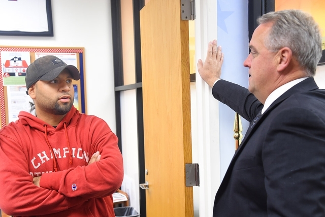 Kevin J. Killea ’88CBA speaking to Luis Escobar