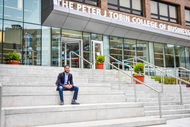 Guy sitting on steps of tobin 