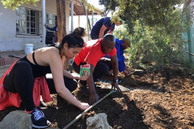 Student working with the soil