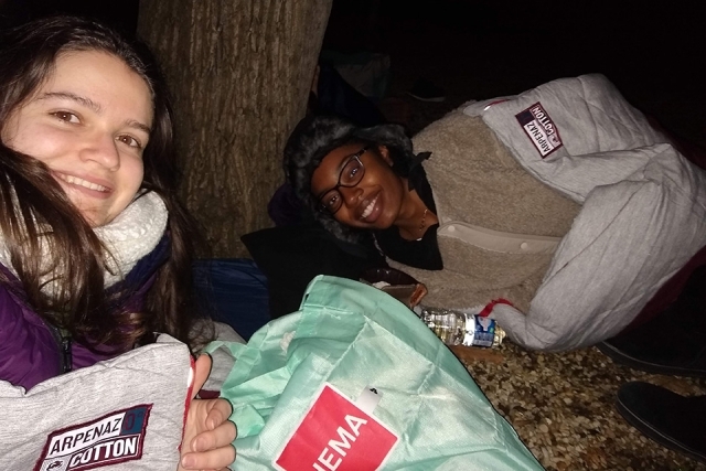 Two St. John's students pose for a picture at night