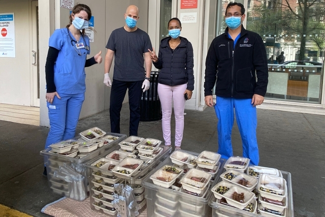 Healthcare workers receiving food donations