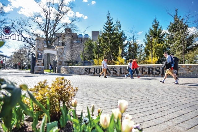 Students walking into front gate of St. John's University