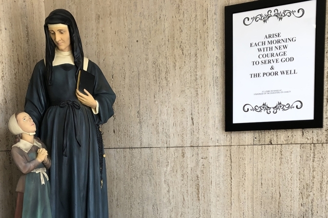 St. Louise de Marillac with child statue and frame