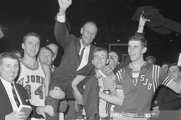 Coach Joe Lapchick carried by Red Storm 