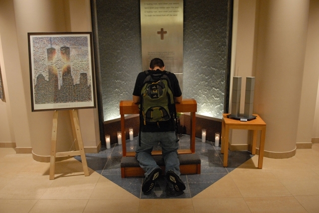 Person praying at 9/11 Memorial in St. Thomas More Church
