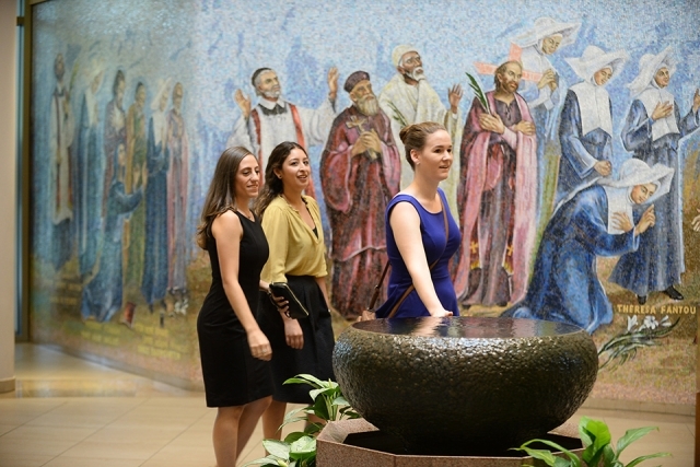 Students in lobby of St. Thomas More Church 