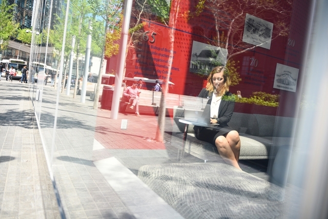 101 Astor Place window with female sitting inside