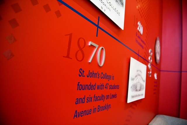 Timeline of St. John's University on a red wall