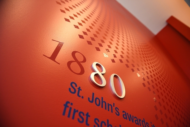 Timeline of St. John's University on a red wall