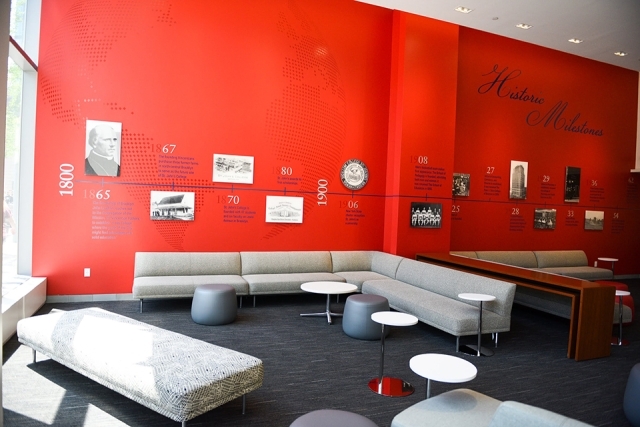 Timeline of St. John's University on a red wall