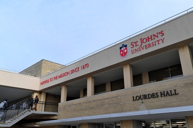 Lourdes Hall exterior with St. John's logo