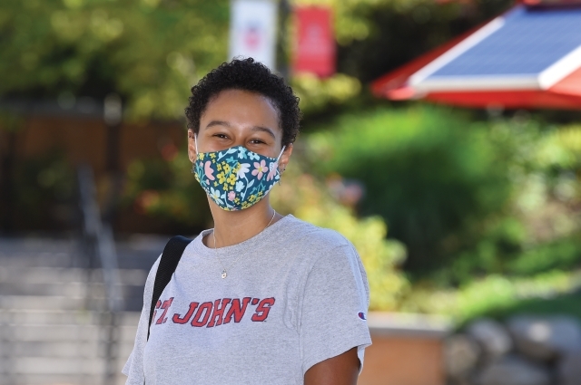 Student in St. John's Shirt wearing face mask