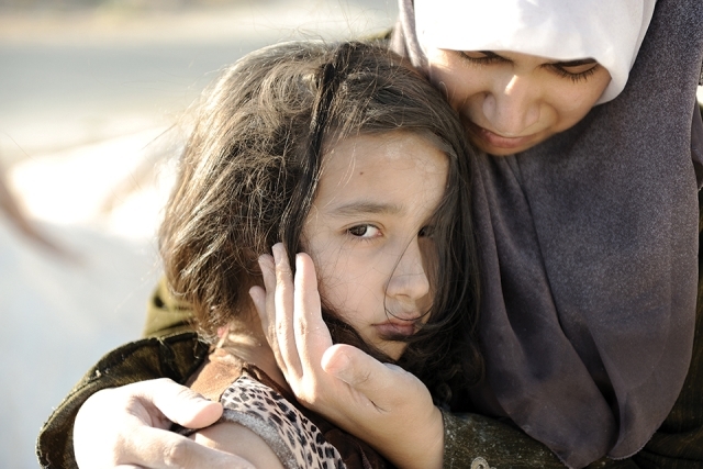 Young woman being comforted by older woman