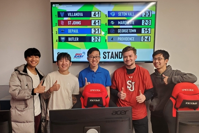 St. John's eSports league members in front of a monitor